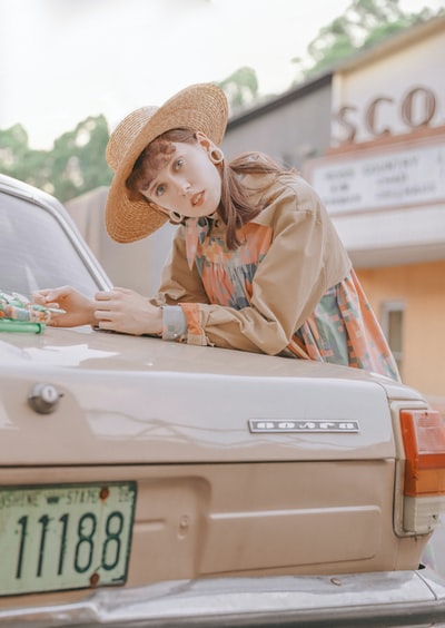 The woman standing in the parking lot
